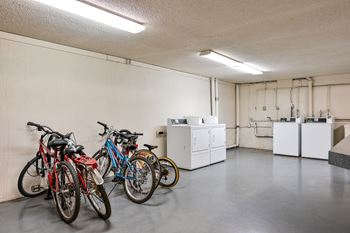 a group of bikes parked in a white room
